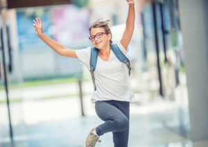 Person Skipping Through Hallway With Arms Raised | GSO