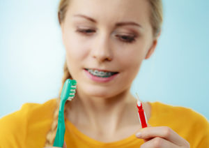 Girl With Braces Holding Toothbrush | GSO