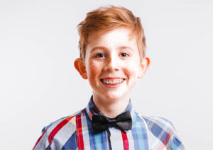 Boy with red hair and braces smiling | GSO