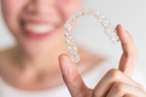 Schedule a virtual consultation to discuss the pros and cons when considering braces or Invisalign.